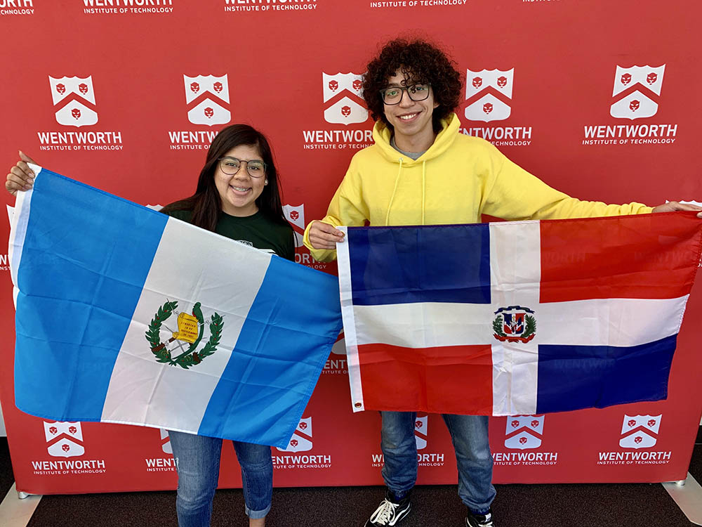 International students showing off their home country flags