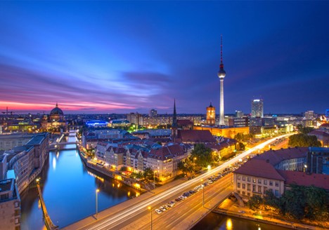 Berlin Germany at night with the building illuminated