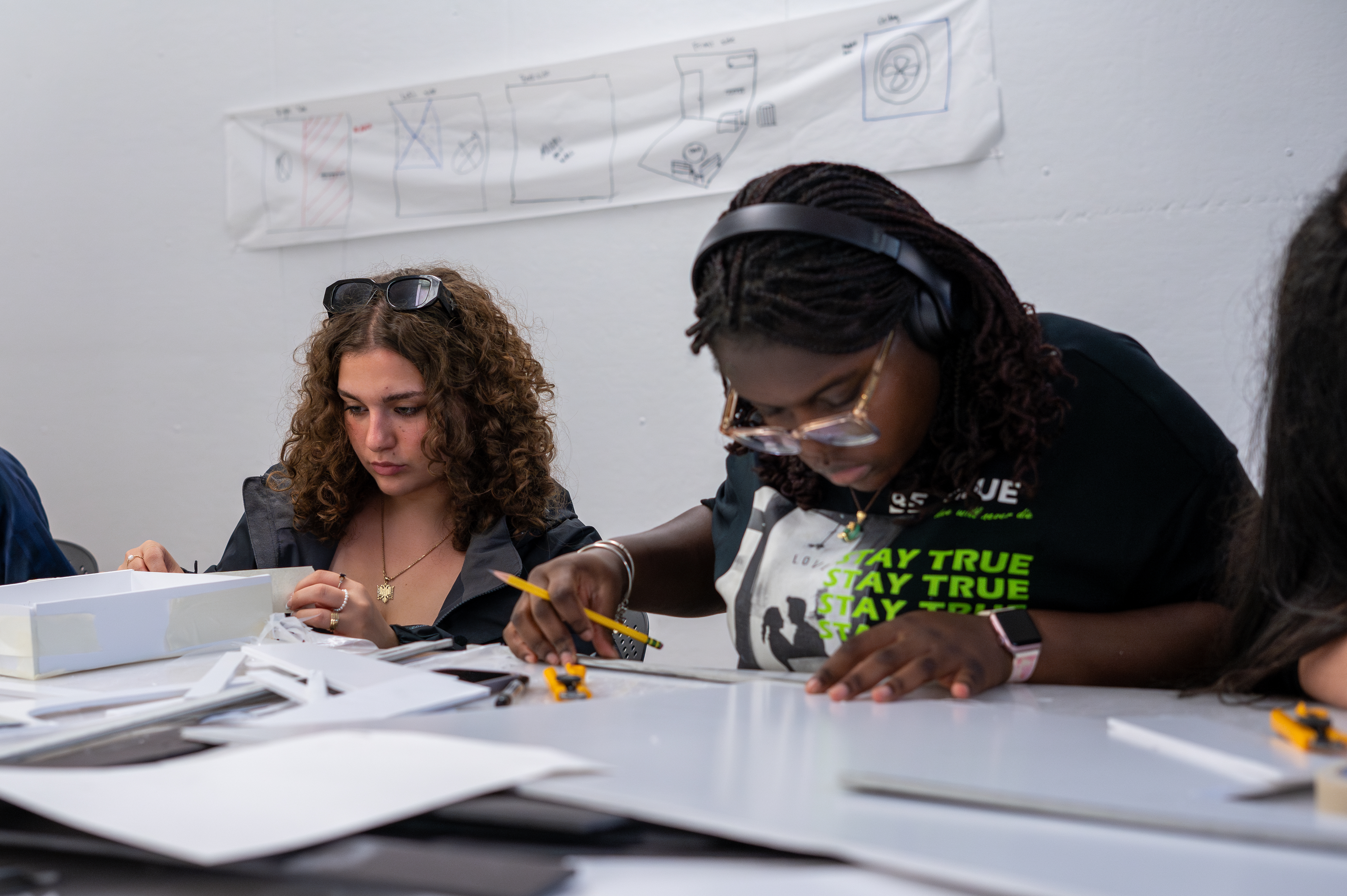 SummerFab students learning and drawing.