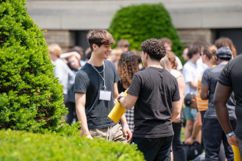 Students meet and talk on the quad at New Student Orientation