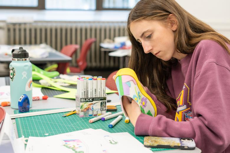 student working on shoe design