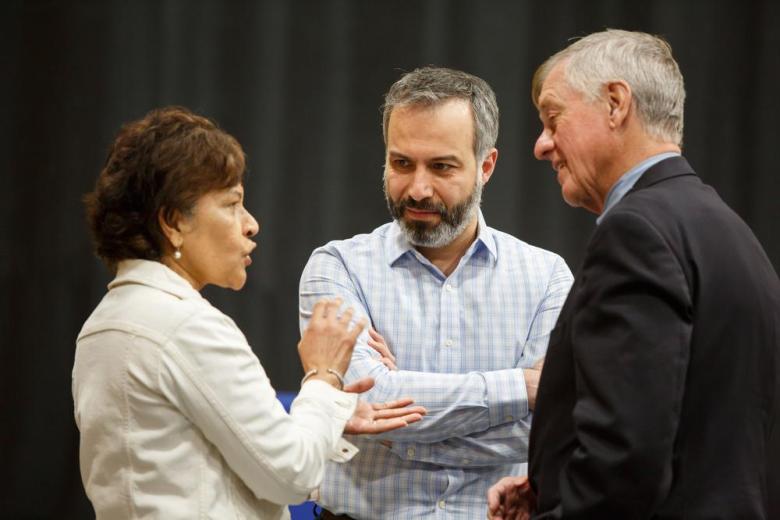 three wentworth employees conversing